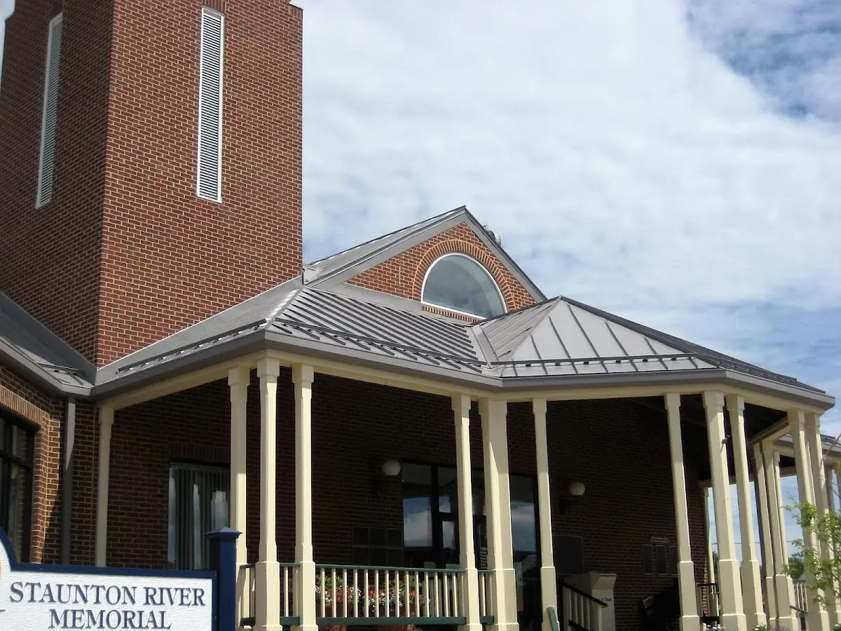Skilled roofing craftsmen working on a residential roof in Covington Central Business District